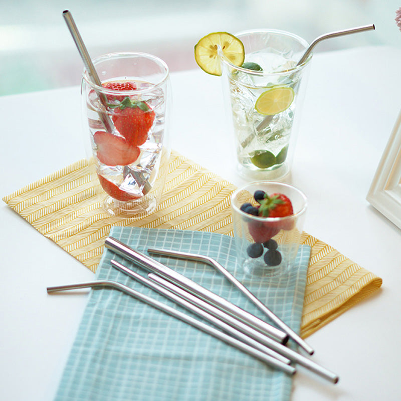Herbruikbare RVS rietjes set met schoonmaakborstel en katoenen draagtas voor duurzaam drinken.